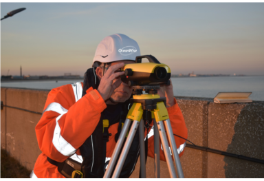 How does GNSS levelling improve tide-gauge accuracy?